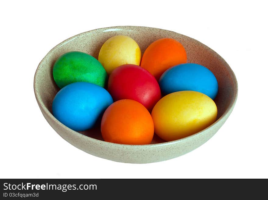 Colorful easter eggs in ceramic bowl isolated on white background