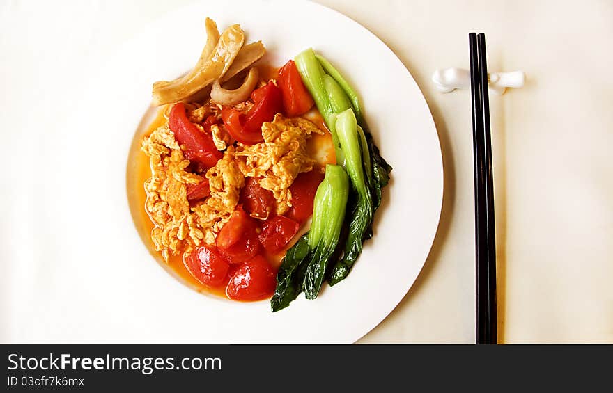 Scrambled eggs with tomatoes ,the most common home cooking in china. Scrambled eggs with tomatoes ,the most common home cooking in china.