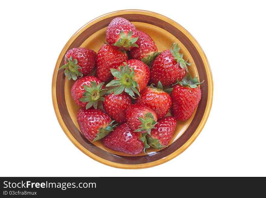 Fresh ripe strawberry on ceramic plate isolated over white background