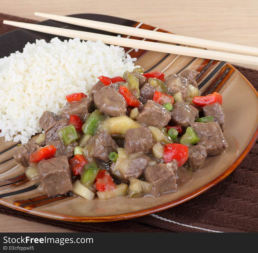 Sweet and sour beef with peppers and rice