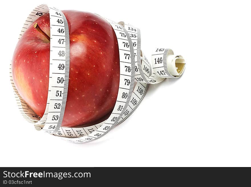 Red apple and measure tape isolated over white