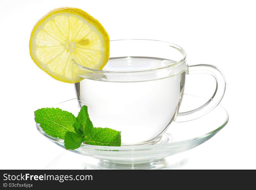 Tea in cup with leaf mint and lemon