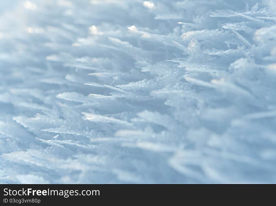 Thin crust of ice over snow, hoarfrost. Texture or background. Thin crust of ice over snow, hoarfrost. Texture or background.