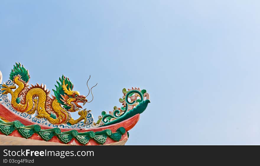 Golden dragon on the roof of the sky as a backdrop