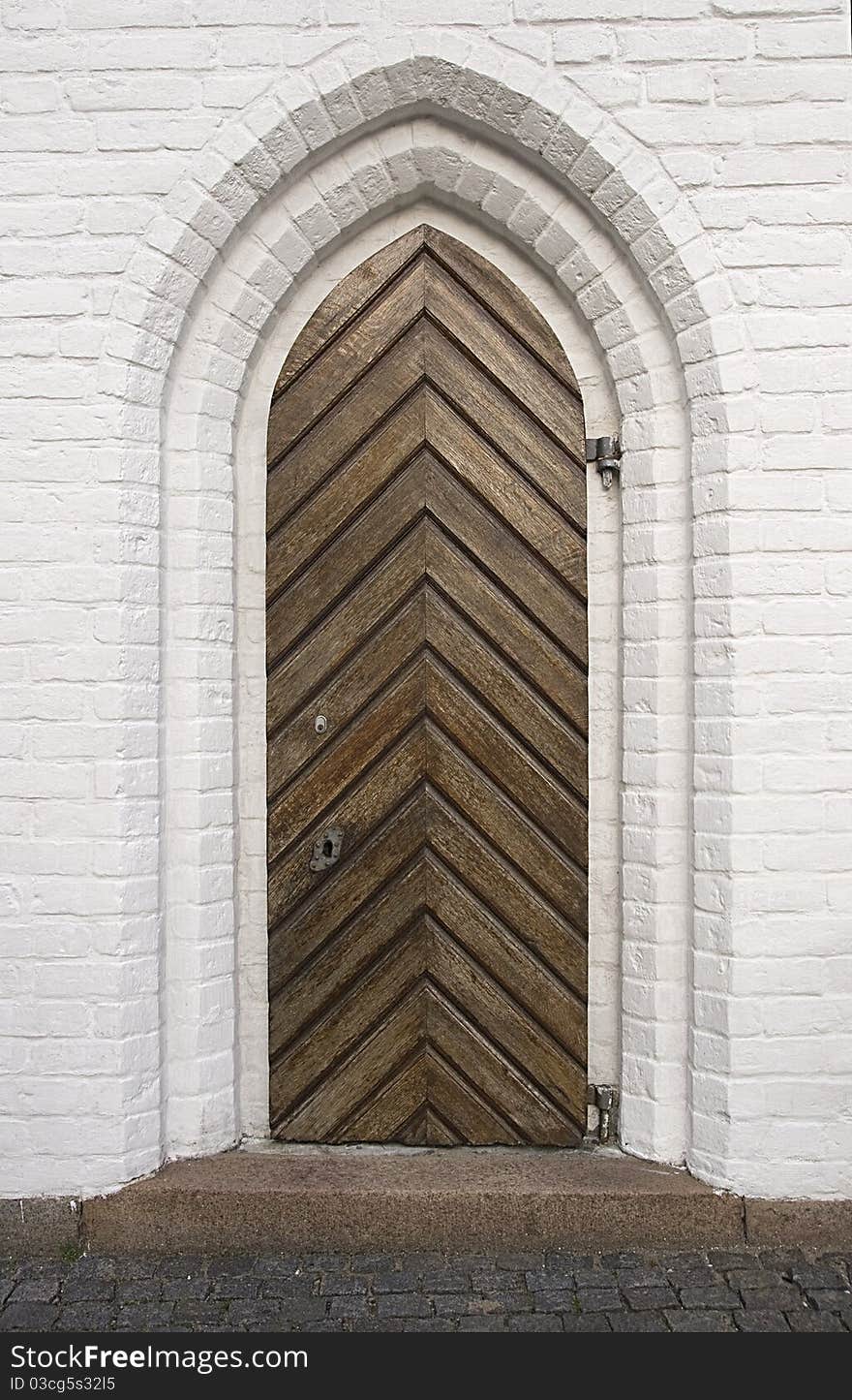 Old wooden gate of a medieval house. Old wooden gate of a medieval house