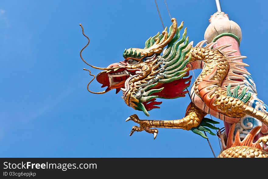 Golden dragon pillars around the sky as a backdrop