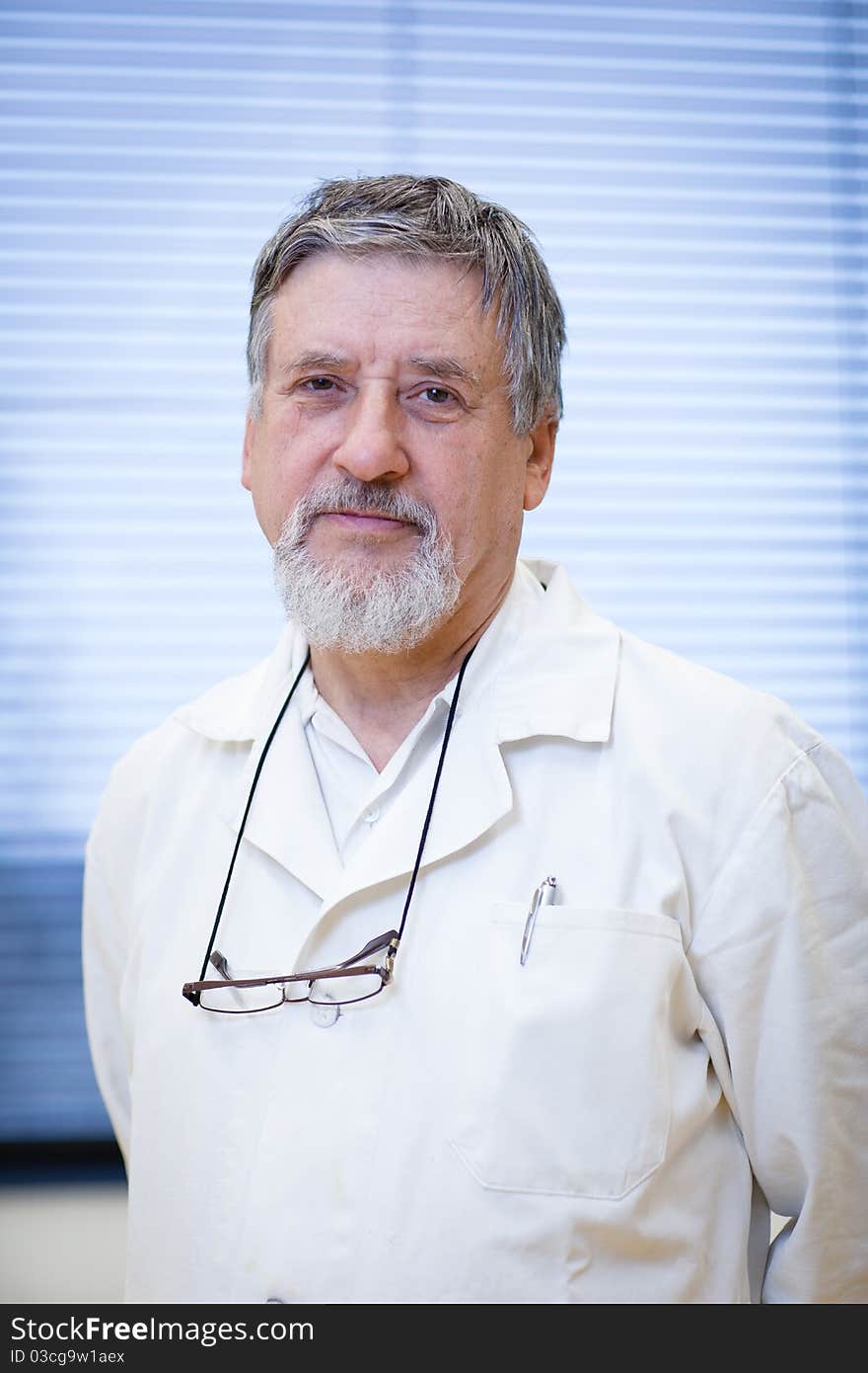 Renowned scientist/doctor in a research center/hospital laboratory looking confident (color toned image; shallow DOF)