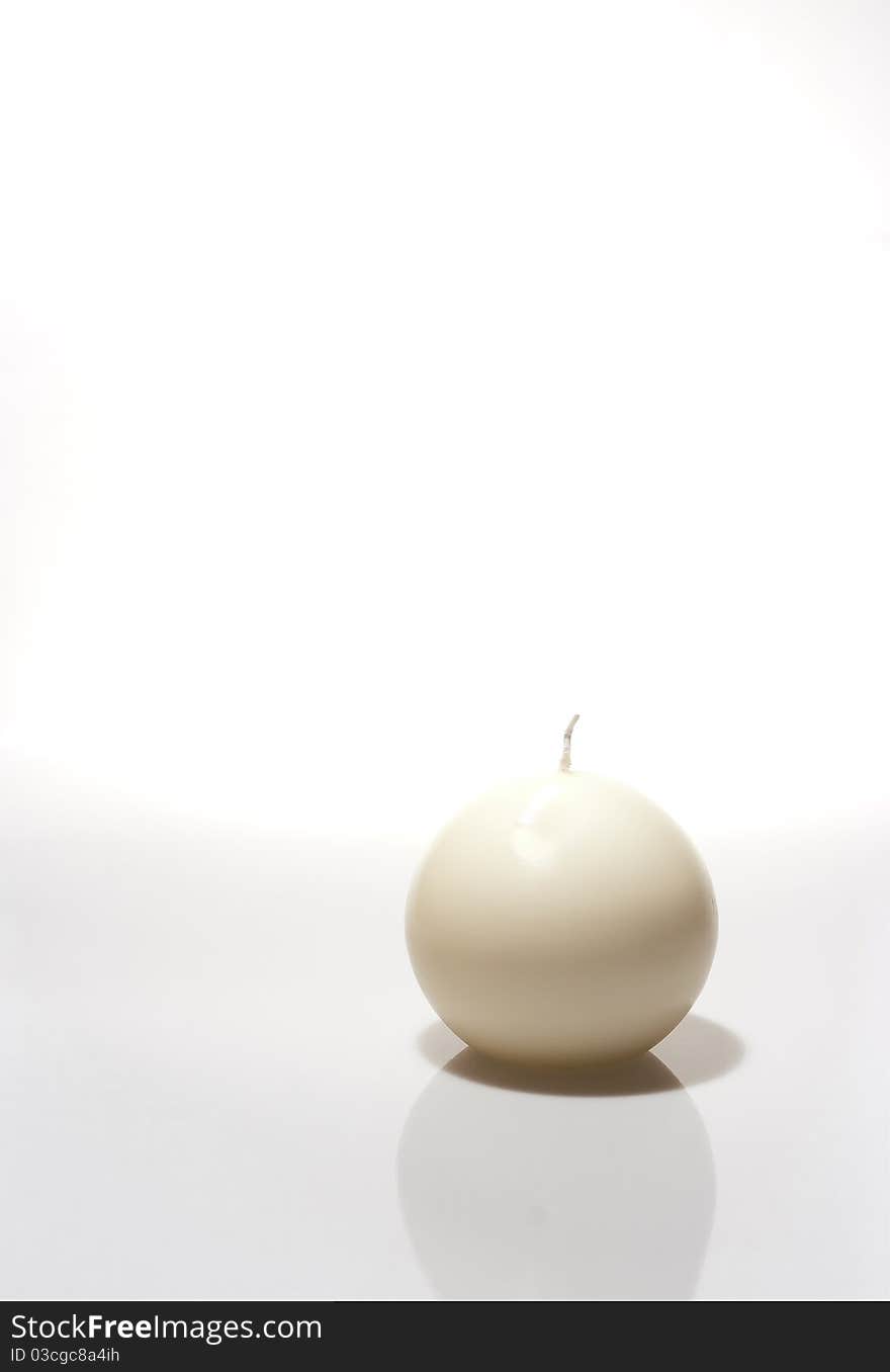 A white candle isolated, white background