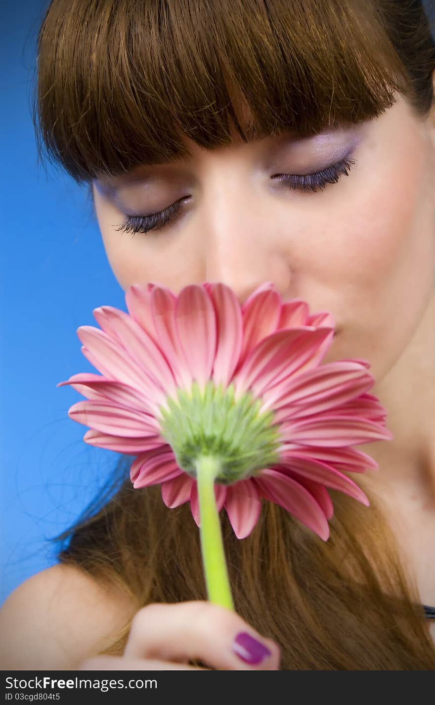 Portrait of a beautiful woman with a flower