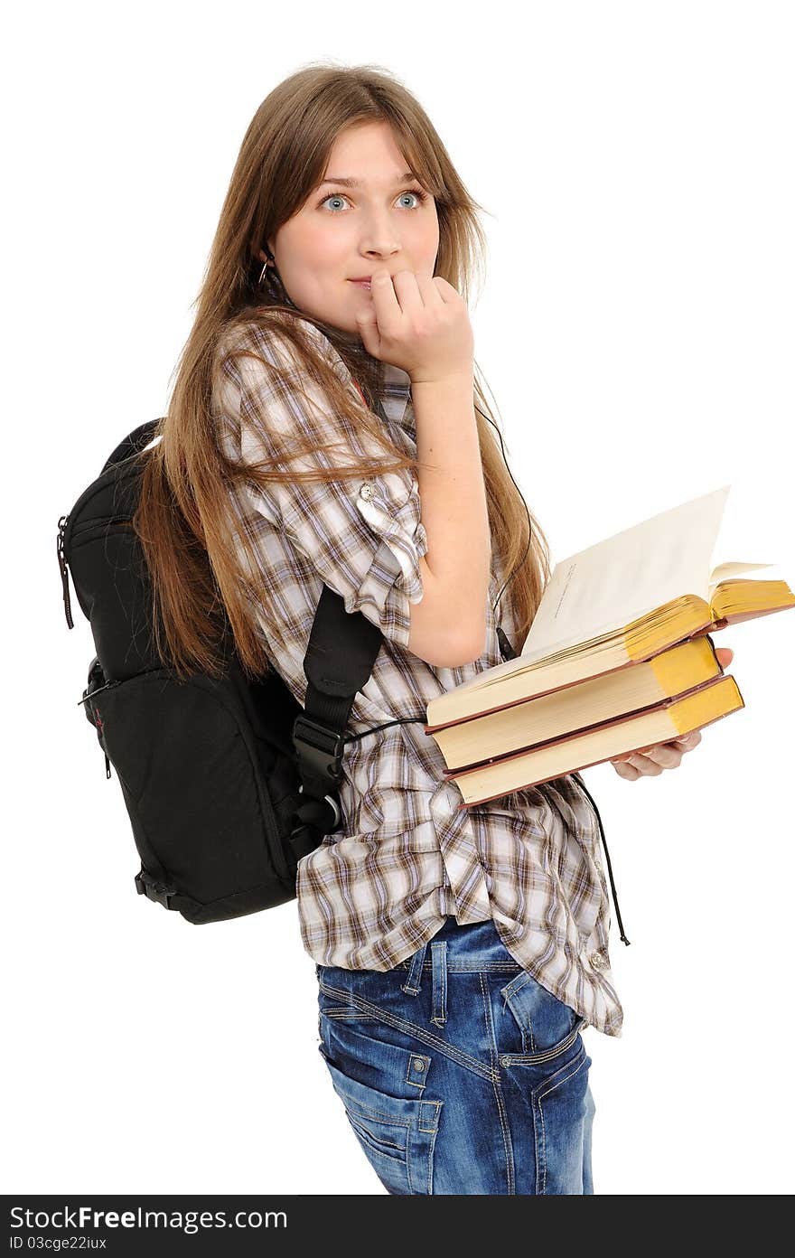 Girl with a backpack and books, is surprised; on a white background. Girl with a backpack and books, is surprised; on a white background