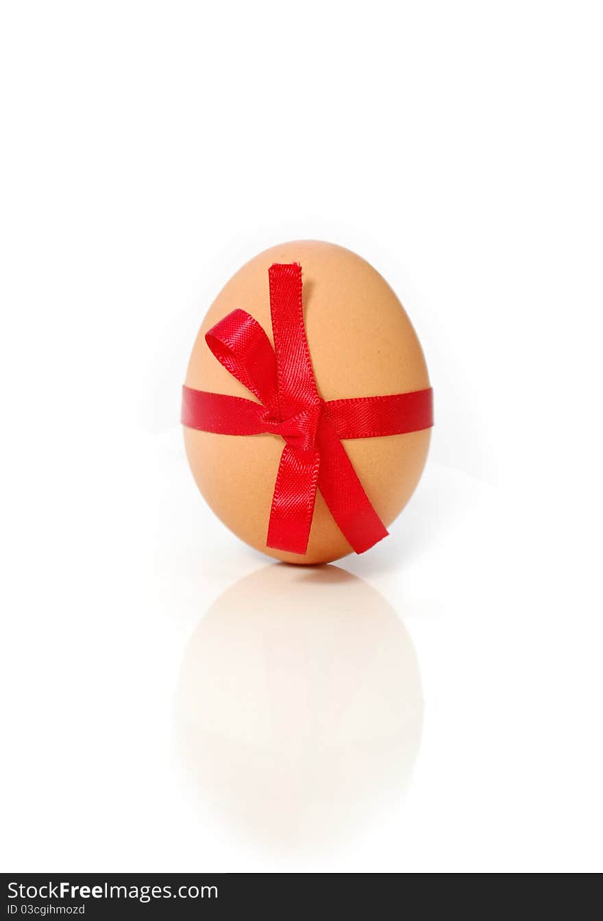 Brown easter egg wrapped with a ribbon bow