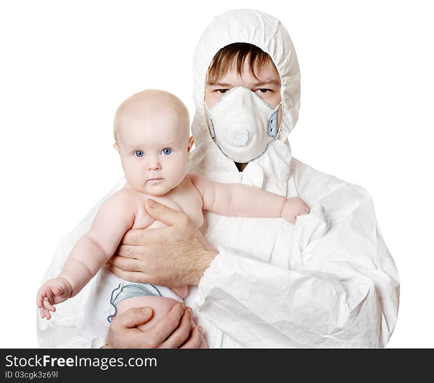 The man in protective clothes and a respirator holds the baby on hands. The man in protective clothes and a respirator holds the baby on hands