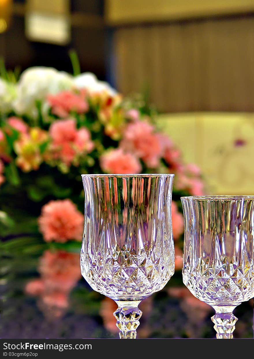 A high-res photo of a formal banquet. Main focus is on the flowers