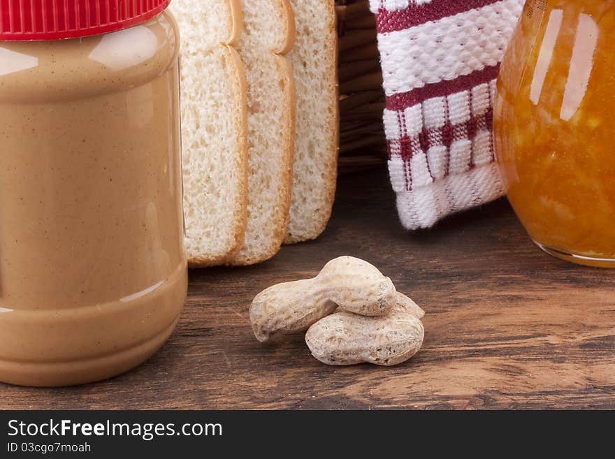 The plastic container with Peanut butter for sweet sandwiches.