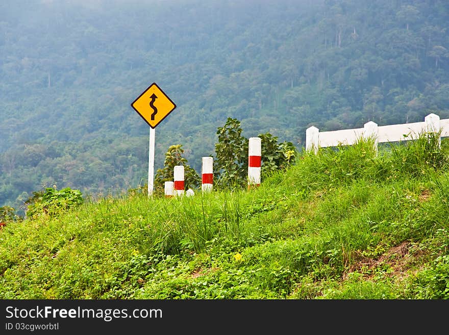 Curve sign for road on mountain