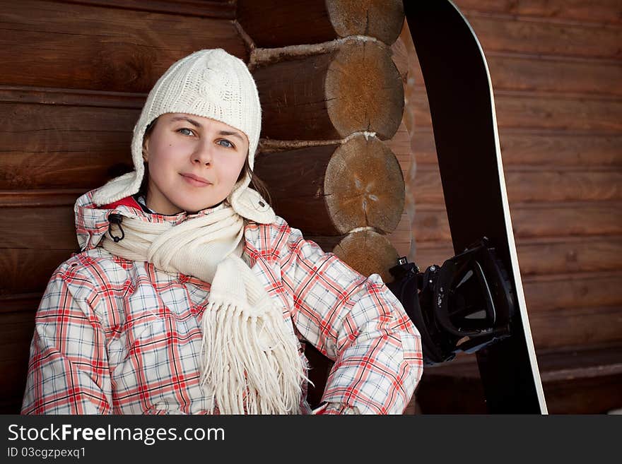 Smiling Teenage Girl With Snowboard