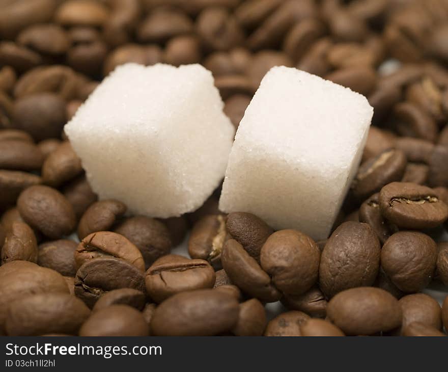 Sugar on a coffee beans closeup