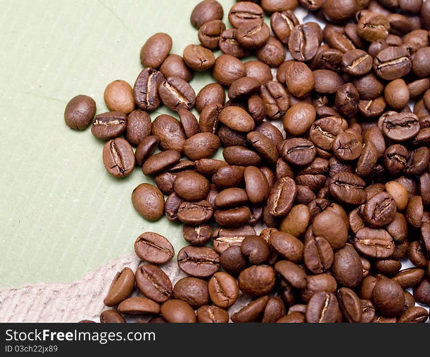 Fragrant fried coffee beans close up