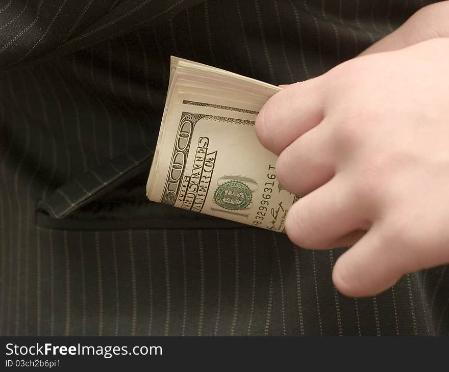 Young man holding a dollar bill