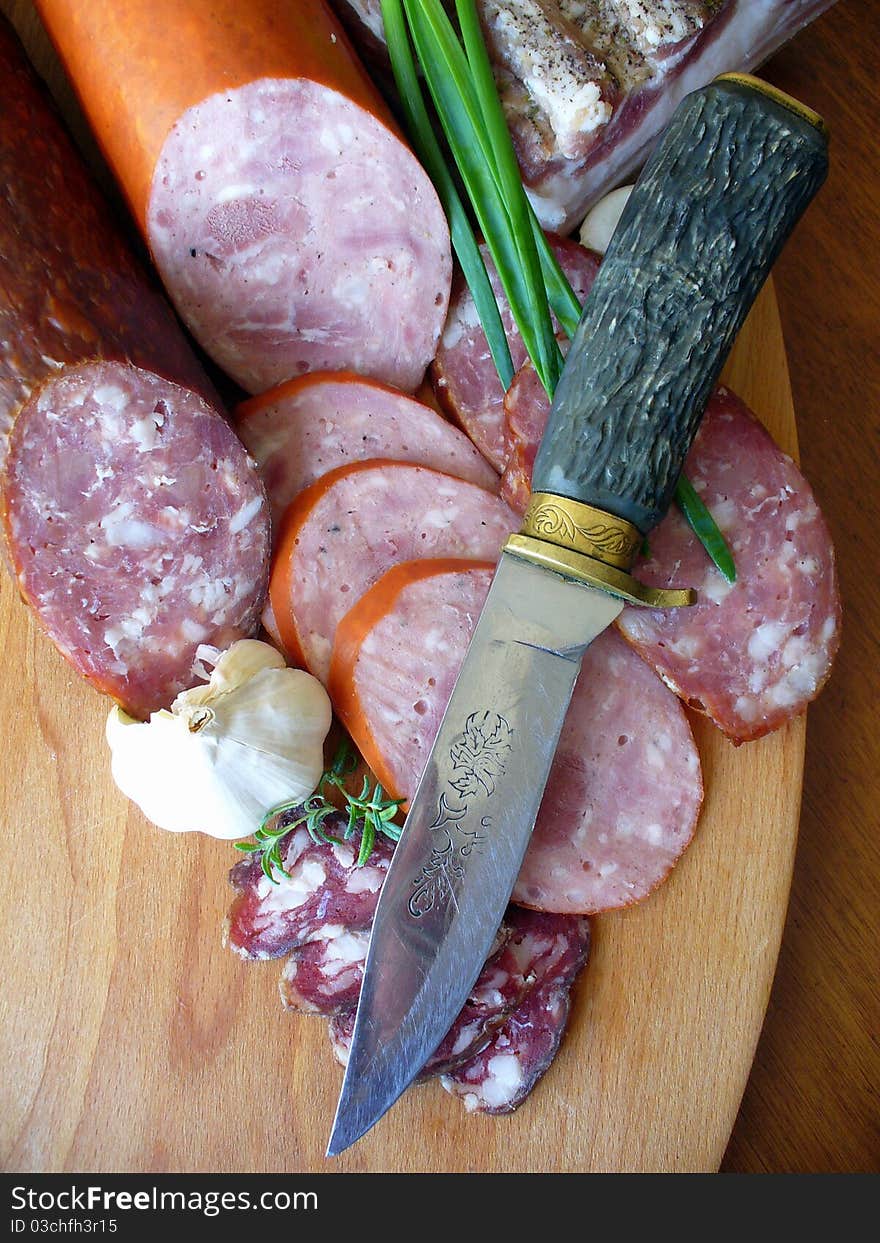 Sausages on a wooden cutting board