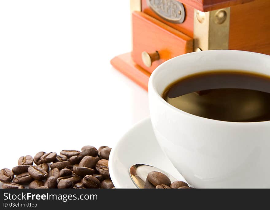 Cup Of Coffee, Grinder And Beans On White