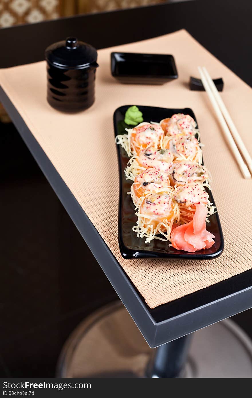 Table place setting with sushi roll