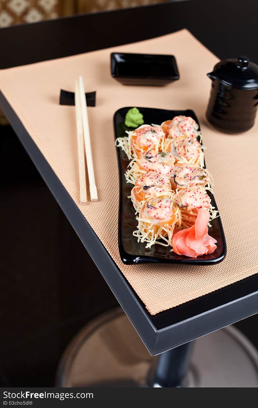 Table place setting with sushi roll