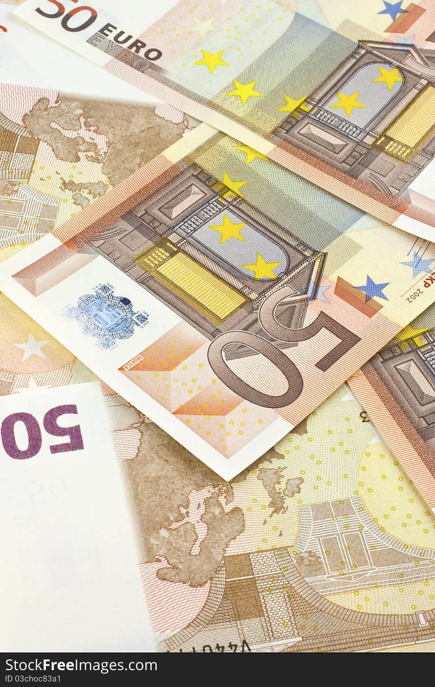 Background of scattered 50-euro banknotes.