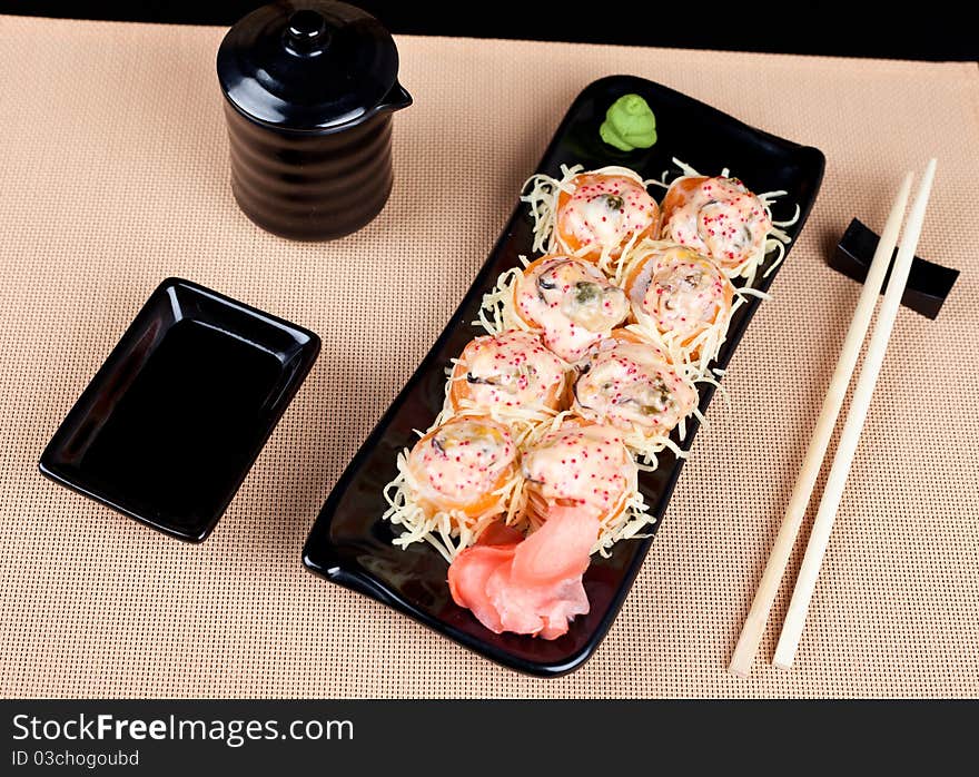 Table place setting with sushi roll