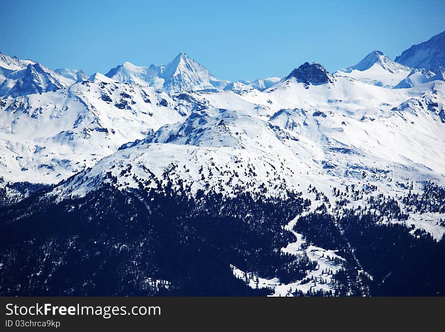 Top of mountains sun in blue sky