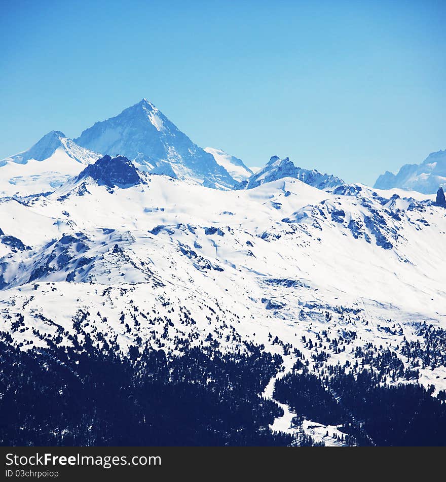 Top of mountains in blue sky