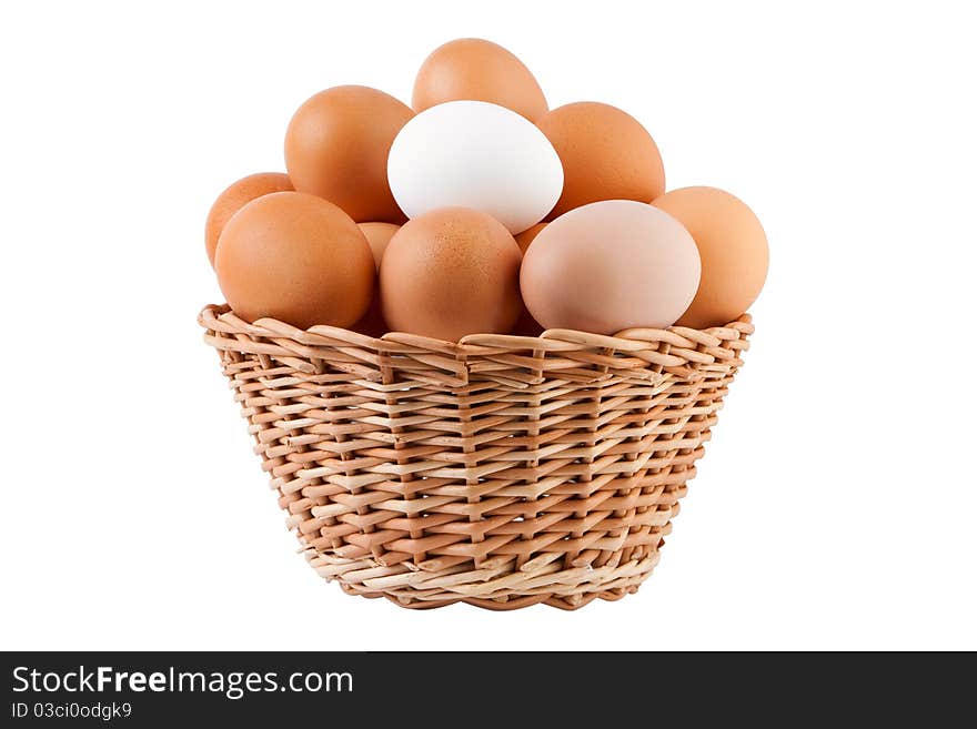 Basket filled with eggs, isolated on white