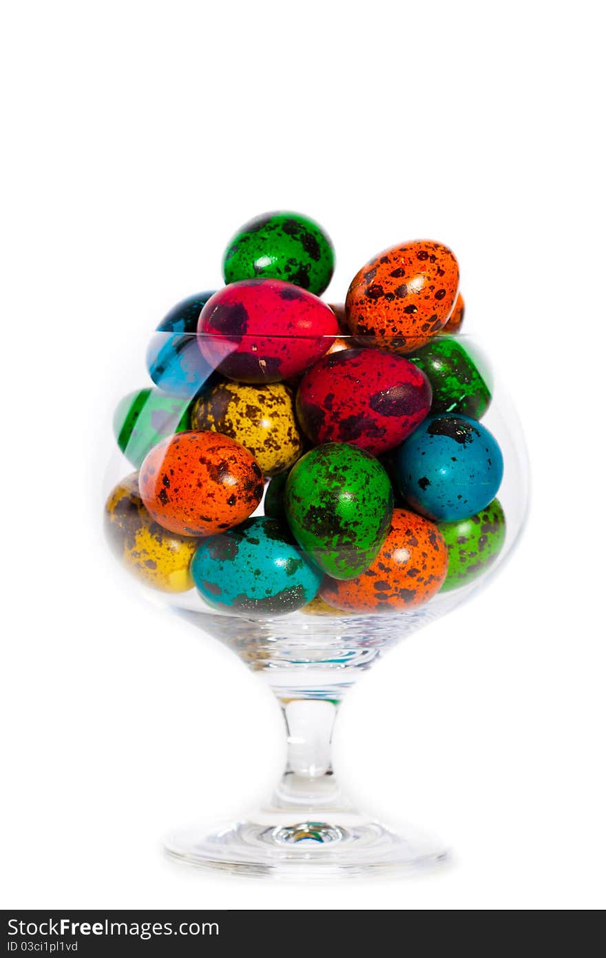 Closeup portrait of Easter colorful eggs in glass