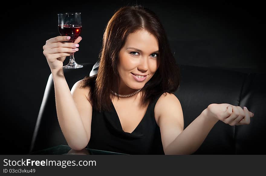 Pretty young women with glass of red wine. Pretty young women with glass of red wine