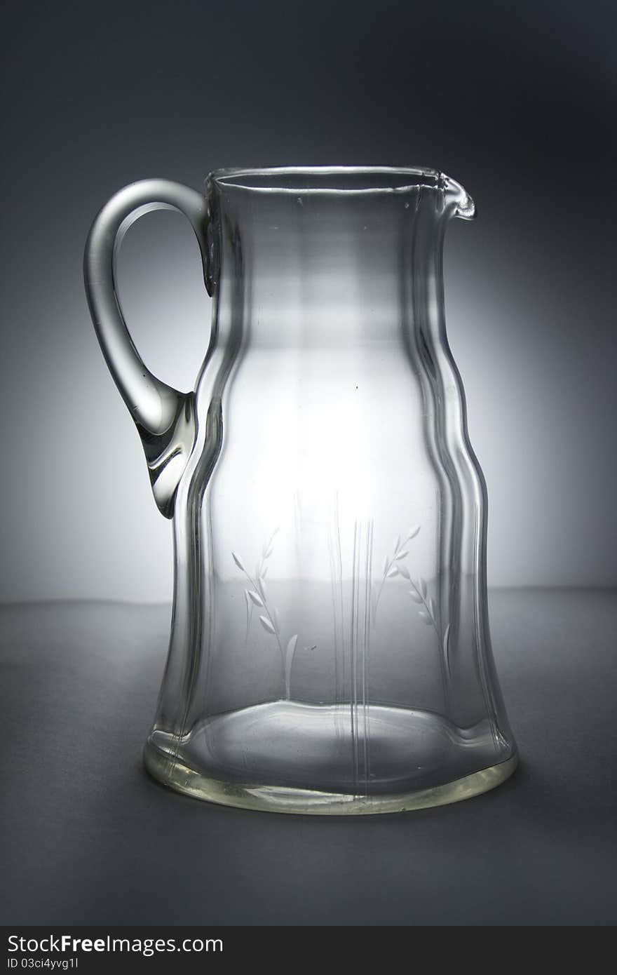 Glass pitcher in studio lights.