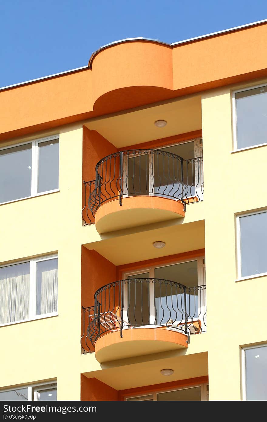 Terraces of residential building on a background blue sky