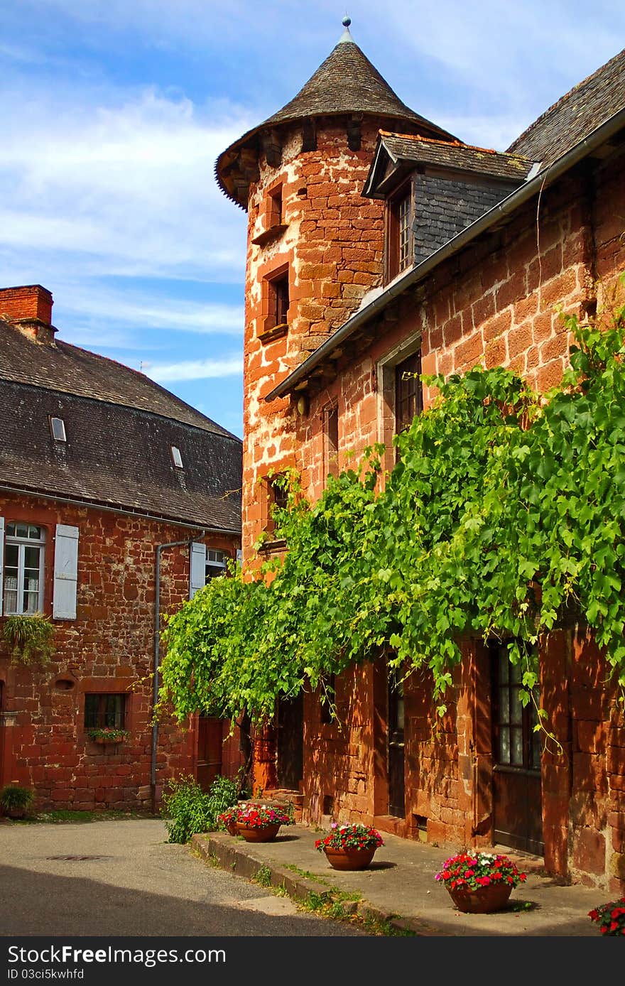 On the photo: Details of old traditional French house. Collonges La Rouge