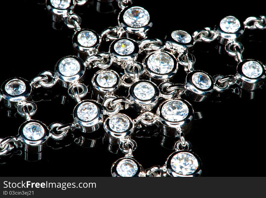 Close-up of a beautiful necklace of diamonds in a black background. Close-up of a beautiful necklace of diamonds in a black background