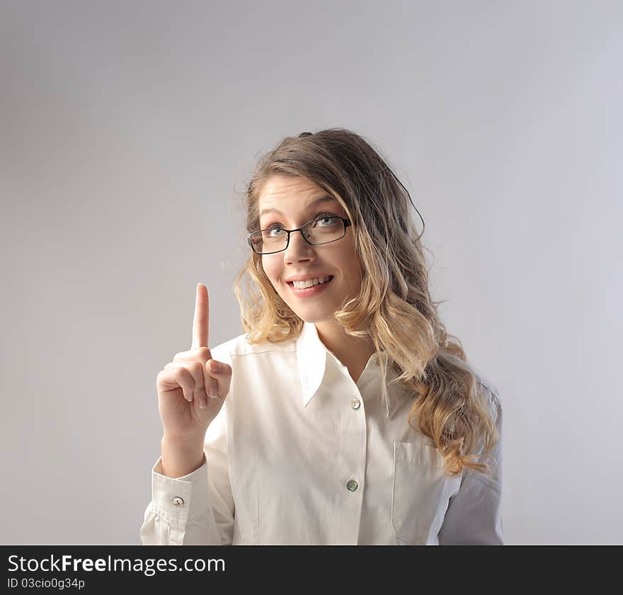 Smiling businesswoman having an idea. Smiling businesswoman having an idea