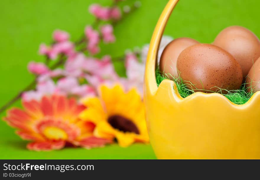 Basket full of Easter eggs and flower