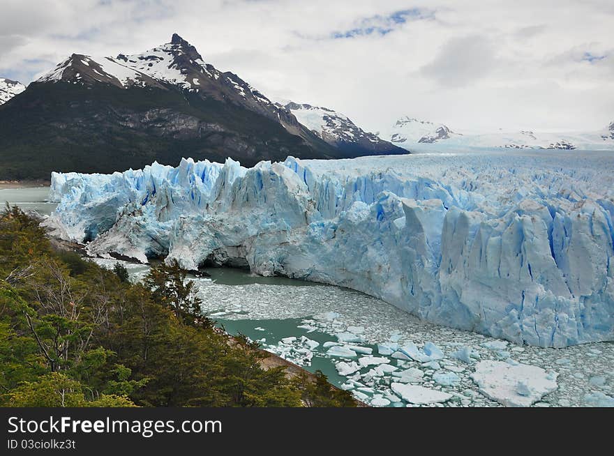 Perito Moreno Glacier, at the Patagonia, in Argentina, with mountains in the background. Perito Moreno Glacier, at the Patagonia, in Argentina, with mountains in the background