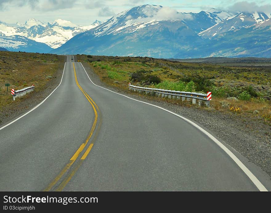 Shot of a road that goes to the mountains, at the Patagonia in Argentina. Shot of a road that goes to the mountains, at the Patagonia in Argentina