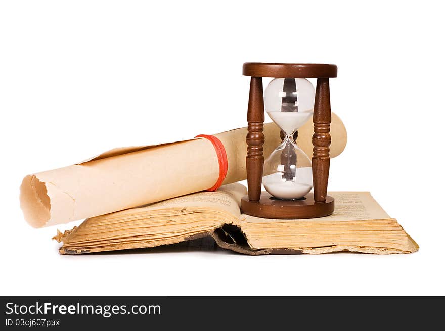 Hourglasses and book on white background