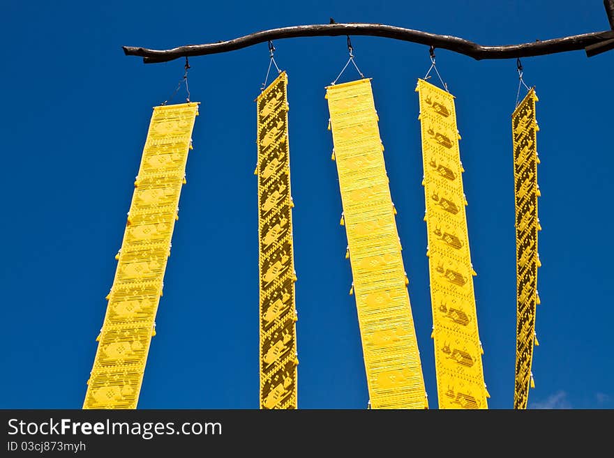 Thai style yellow craft, hanging under the open sky. Thai style yellow craft, hanging under the open sky