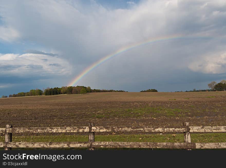 Rainbow over a Farm Field