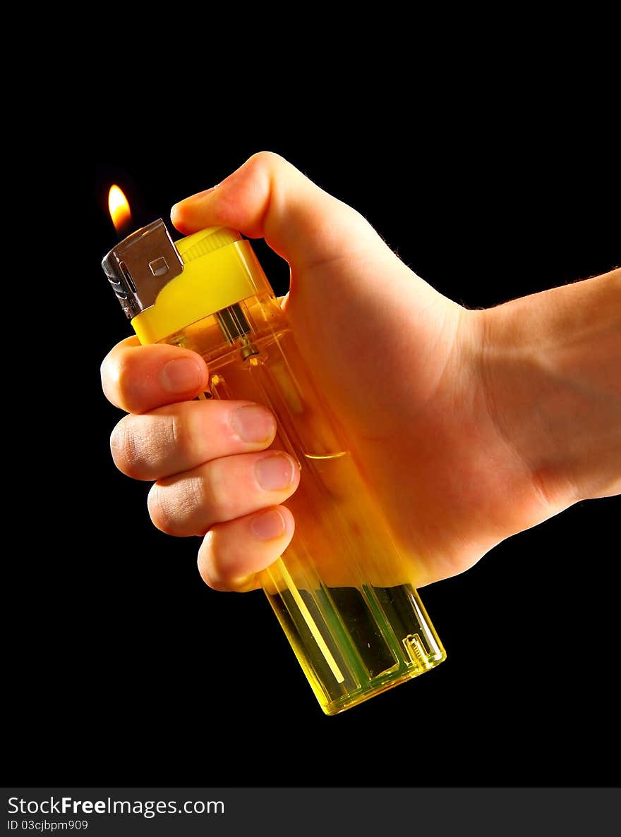 Male hand holding a lighter.