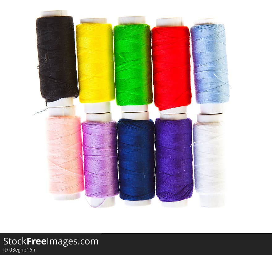 Colorful sewing threads isolated on white