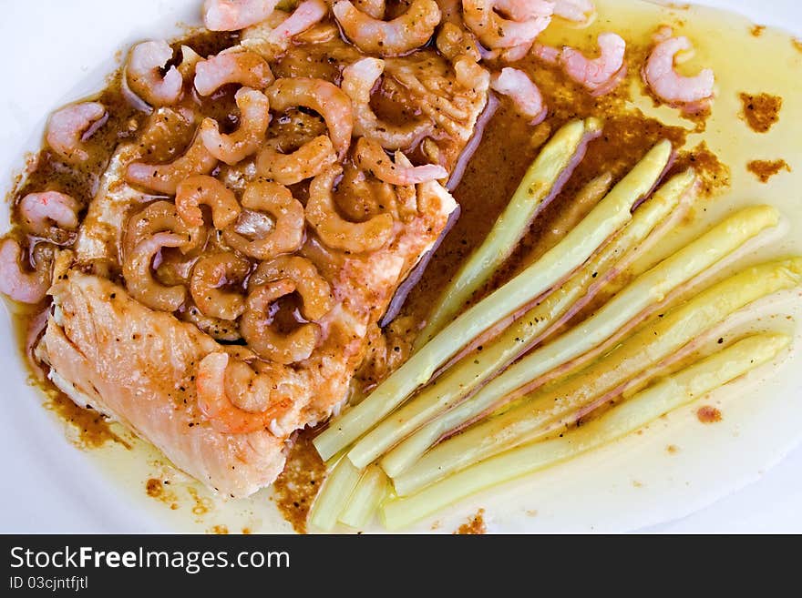 Smoked whitefish served with lemon tomato pepper marinade sauce and shrimps, closeup. Smoked whitefish served with lemon tomato pepper marinade sauce and shrimps, closeup.