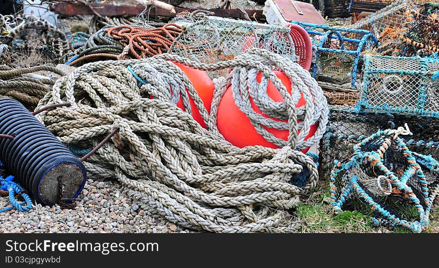 Assortment of Fishing Gear also ropes and buoys. Fishing gear is the tool with which aquatic resources are captured, whereas the fishing method is how the gear is used. Gear also includes harvesting organisms when no particular gear &#x28;tool&#x29; or boat is involved. Furthermore, the same fishing gear can be used in different ways by different fishers. There are two main types of devices used to capture fishes in both marine and inland fisheries: ADVERTISEMENTS: &#x28;1&#x29; Nets or gear — these are instruments used for catching fish. &#x28;2&#x29; Crafts or Boats — It provides a platform for fishing operations, carrying the crew and fishing gears.