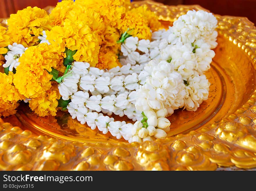 Jasmine garland on gold plate for the worship ceremony